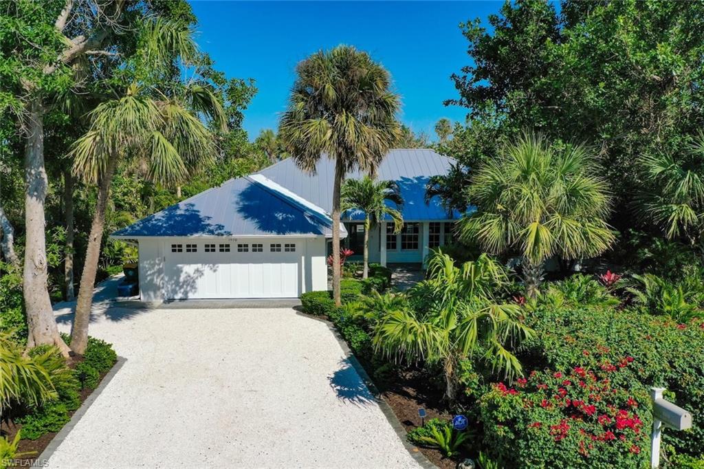 Sanibel Ridge Retreat — Elevated Luxury & Peace of Mind
Situated atop the Sanibel Ridge, one of the island’s highest elevations, this 4-bedroom, 3-bath concrete block home offers exceptional natural protection from weather events. Built in 1999 and thoughtfully upgraded with nearly $1M in improvements, this front-to-back split residence blends refined island style with enduring resilience. Cathedral ceilings crown the open-concept living, dining, and kitchen areas, accented by shiplap detailing and abundant natural light. Expansive glass pocket doors open to a spacious screened lanai with saltwater pool, creating seamless indoor-outdoor living. The remodeled chef’s kitchen features Cambria quartz countertops and backsplash, custom cabinetry, Café appliances, gas range, and Bosch dishwasher. Extensive upgrades include a standing-seam metal roof, porcelain plank flooring throughout, remodeled primary suite and bath, updated lighting and fans, new HVAC with humidity control, whole-home water filtration, impact garage door, AstroGuard hurricane shutters, and new pool heater and equipment (2025). Professionally designed tropical landscaping surrounds the home with privacy, featuring mature bougainvillea, palms, orchids, and winding shell paths. Elevated above the Ding Darling Wildlife Preserve, this property offers serene views, lasting protection, and a rare combination of luxury, elevation, and island tranquility. A true Sanctuary on Sanibel Island.