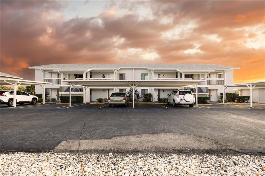 Spacious and full of potential! This first-floor 2BR/2BA Gulf-access condo features sunny southern exposure, an end-unit layout with extra natural light, a large living room, and a dining area perfectly sized for a 6-person table. Additional highlights include impact-protected window and all over hurricane coverage, inside laundry, an eat-in kitchen, and a screened lanai. The primary suite offers lanai access, a walk-in closet, and an ensuite bath with a walk-in shower. Assigned carport plus guest parking just outside your front door. Harbor Castle is a privately run HOA offering a heated pool and opportunity to add a boat slip. Just steps to Downtown Cape Coral—restaurants, bars, shops, farmers market, and more. Priced to sell and ready for your updates.