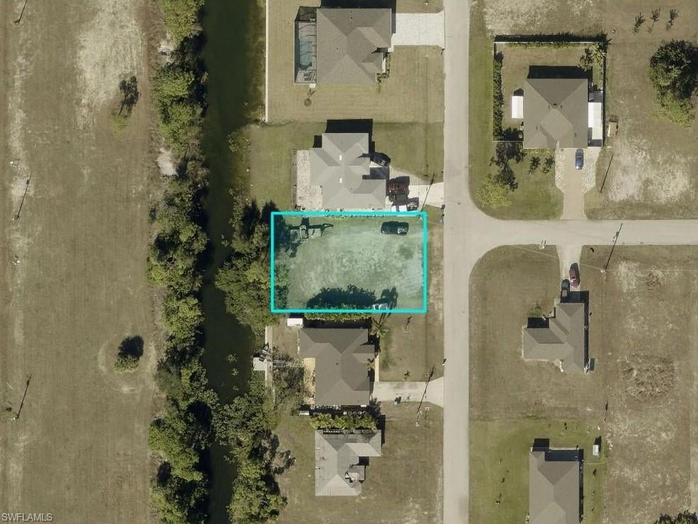 Do not miss the opportunity to buy this Western Exposure Fresh Water Buildable Lot, ready for you to build a New Home. NO Restrictions, Clear of environmental request. Coral Oaks Golf Course is nearby and just a short car ride to all the amenities of Cape Coral and Ft Myers. This lot is in a premium location for your South-West Florida Future! Captivating cleared lot situated in a growing area can also be good to hold for an investment. Build Your Dream Home today or Invest for the Future.