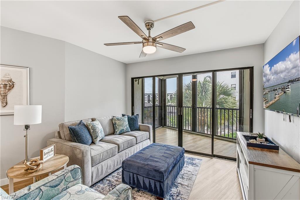 Stunning renovation just completed in this Anglers Cove unit with covered assigned parking space. You will enjoy the new kitchen, bath, living room and bedroom updates. New luxury vinyl floors, appliances, and lighting round off the fresh new feel. Enjoy a cocktail from the enclosed lanai with the tropical views of the grounds, pool and a peak of the bay. The 01 units offer a unique view advantage due to the building design. This unit already has the recently required impact windows and doors installed. 
Anglers Cove is a waterfront condominium overlooking Factory Bay and the Marco River. Amenities include two heated pools, hot tub, tennis courts and on-site Dolphin Tiki Bar & Grill. Boat docks are available for lease, offering quick access to the Gulf for boating or jet skis. Conveniently located on the island, it is close to dining, shopping and beaches. The highly sought after, assigned parking spot next to the elevator offers convenience in this popular destination for both personal use or proven investment opportunities offering weekly rentals. The tropical landscaping and association updates make paradise retreat a relaxing experience. Electric, water and cable are included in the HOA fees. Easy to show so book your private showing today.