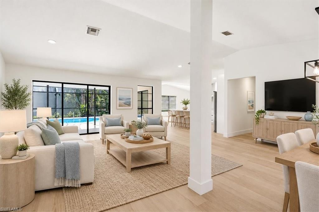 One or more photo(s) has been virtually staged, AI generated or rendered.  Completely Renovated & Move-In Ready! Welcome to 9918 Country Oaks Drive, where modern finishes, thoughtful upgrades, and effortless Florida living come together in the charming Country Oaks neighborhood. This beautifully renewed single-story ranch offers 3 bedrooms, 2 bathrooms, and 1,936 square feet of light-filled living space, featuring an open-concept layout and vaulted ceilings in both the living and family rooms. No detail has been overlooked in the comprehensive renovation, with new luxury vinyl plank flooring, baseboards, interior paint, lighting, fixtures, sky lighting, and Hunter Douglas window treatments throughout. The redesigned kitchen showcases soft-close cabinetry, quartz countertops, an oversized stainless steel sink, and upgraded appliances, including a built-in wall oven and microwave, electric cooktop, refrigerator, dishwasher, and range hood. Both bathrooms have also been remodeled with new cabinetry and quartz surfaces. The spacious primary suite features a walk-in closet, dual sinks, and a tiled walk-in shower. Additional highlights include an oversized laundry room with abundant cabinetry, utility sink, pantry closet, and washer and dryer connections, along with a brand-new 2026 AC system. Outside, enjoy the Florida lifestyle beneath the expansive covered lanai overlooking the screened pool. A newly installed pool screen enclosure, updated and serviced pool equipment, refreshed irrigation, and new tropical landscaping enhance the outdoor experience. A screened front entry, generous driveway and front yard, and attached two-car garage complete the property. Conveniently located near FGCU, Hertz Arena, Miromar Outlets, Gulf Coast Town Center, Three Oaks Park, I-75, shopping, dining, schools, and the airport, this extensively renovated home delivers the perfect combination of modern comfort, outdoor enjoyment, and everyday convenience. Simply move in and enjoy!