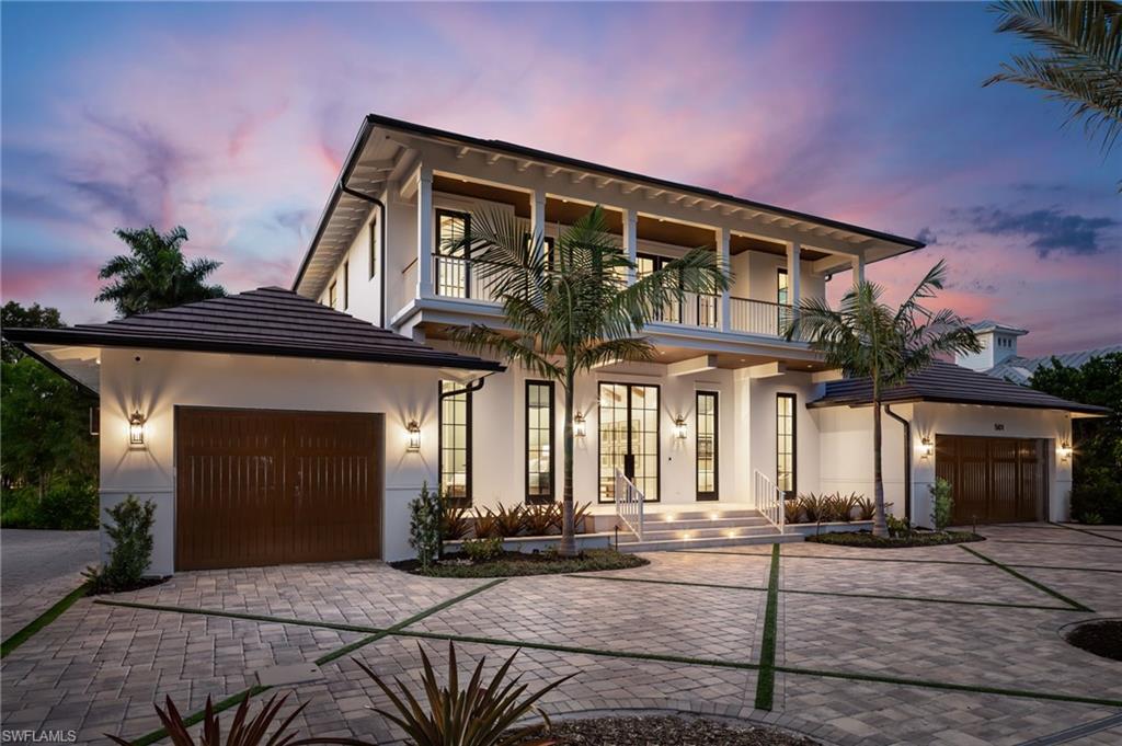Located on an oversized parcel in one of Old Naples’ most walkable residential enclaves, this newly constructed estate blends British West Indies
architecture with uncompromising modern performance. Encompassing 5,449 square feet of interior living space, the residence was designed by
MHK Architecture, built by Lotus Construction, and furnished by Freestyle Interiors - all under the direction of New England-based developers
EMB Custom Homes. The layout is anchored by two full primary suites, one on each level -
making the home ideal for multigenerational living or extended guest accommodations. The second floor is dedicated entirely to a private
owner’s retreat, featuring a large bedroom, lounge-style family room, private fitness area, and dual balconies overlooking the manicured
grounds. A total of five oversized bedrooms and six bathrooms are complemented by two laundry centers, a three-car split garage, and elevator
access to all levels. Each bath is outfitted with Toto Neorest 700 intelligent toilets. The open living spaces are framed by custom millwork,
generous ceiling heights, and seamless transitions to the outdoors. The chef’s kitchen features a full Wolf/Sub-Zero appliance suite, Miele coffee
stations on both levels, and ample storage integrated into clean-lined cabinetry. Adjacent dining and living areas open directly to the custom
pool and sunken spa, designed for both privacy and function. A full smart home automation system governs lighting, audio, HVAC, and security.
Other features include custom closets throughout, a full-home generator, and mature landscaping designed to provide privacy while preserving the homes connection to its Old Naples setting. The gulf beaches, Fifth Avenue, and Third Street South’s dining and shopping are all within easy walking or biking
distance - placing this property in a prime position for those seeking both proximity and discretion.