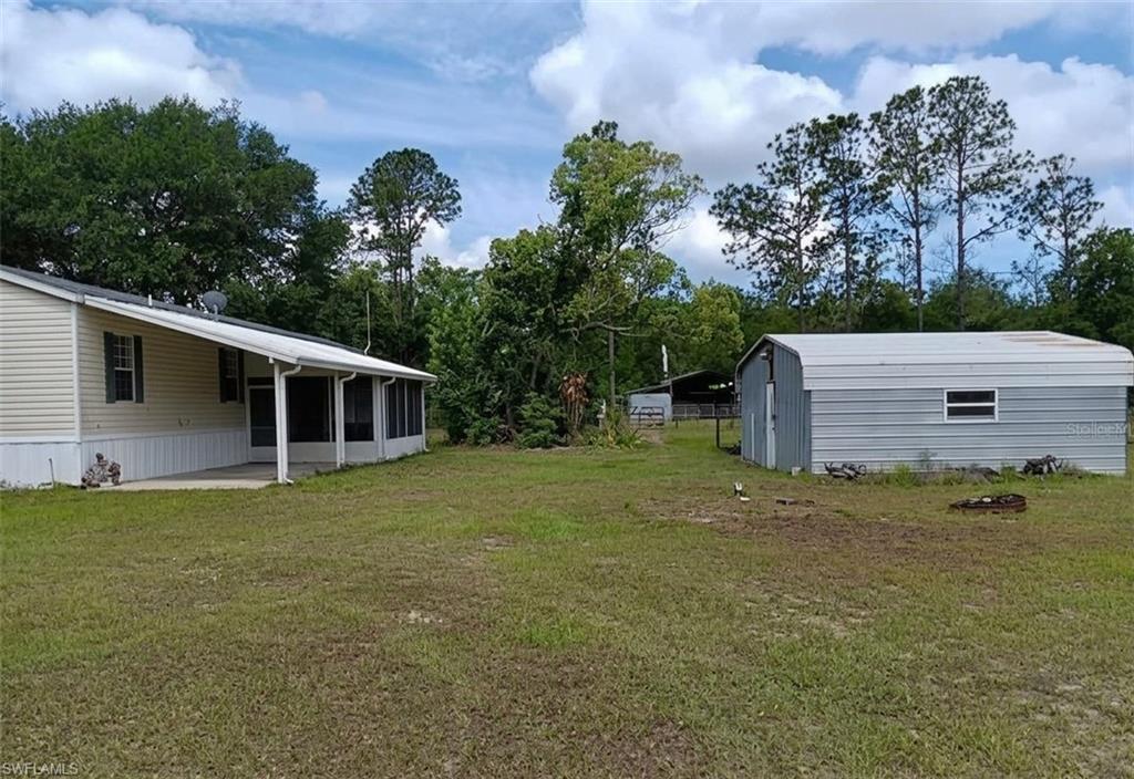 Peaceful two-bed, two-bath single-wide on three acres in Wiersdale. Split bedroom layout gives you privacy, tons of built-ins, all appliances included, partial furnishings, barn, carport, and screened Florida room. Perfect for comfortable country living! Escape to your own slice of Florida serenity! The water system has a water filtration system for the entire house giving you peace of mind that you will have good water. This charming single-wide sits on three peaceful acres in Wiersdale, complete with a cozy barn, covered carport, and a screened-in Florida room perfect for sipping sweet tea and sunsets. Your private country retreat awaits!”