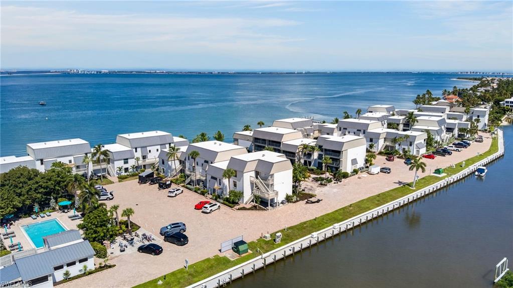 Everything is new at Mariner Pointe 811, a 2-bedroom, 2-bath condo with views of both the bay and the canal. The unit has been completely redone, from the plumbing and electrical behind the walls to the furnishings in every room. The AC system, water heater, and all appliances are brand new too, so the big-ticket items are already taken care of. For boaters, the location is a dream: direct access to the water puts the bay and the Gulf within easy reach of your door. Back at home, the condo comes fully furnished with all-new pieces and is ready to enjoy from day one, whether as a full-time residence, a seasonal getaway, or a rental. Mariner Pointe sits on the bay side of Sanibel, with community amenities, such as 2 pools, tennis courts, pickleball courts, a fishing pier, and boat docks. The island’s beaches, shared-use paths, shops, and restaurants, as well as the J.N. “Ding” Darling National Wildlife Refuge, are all a short drive or bike ride away. All new, fully furnished, and on the water. Schedule your showing today.