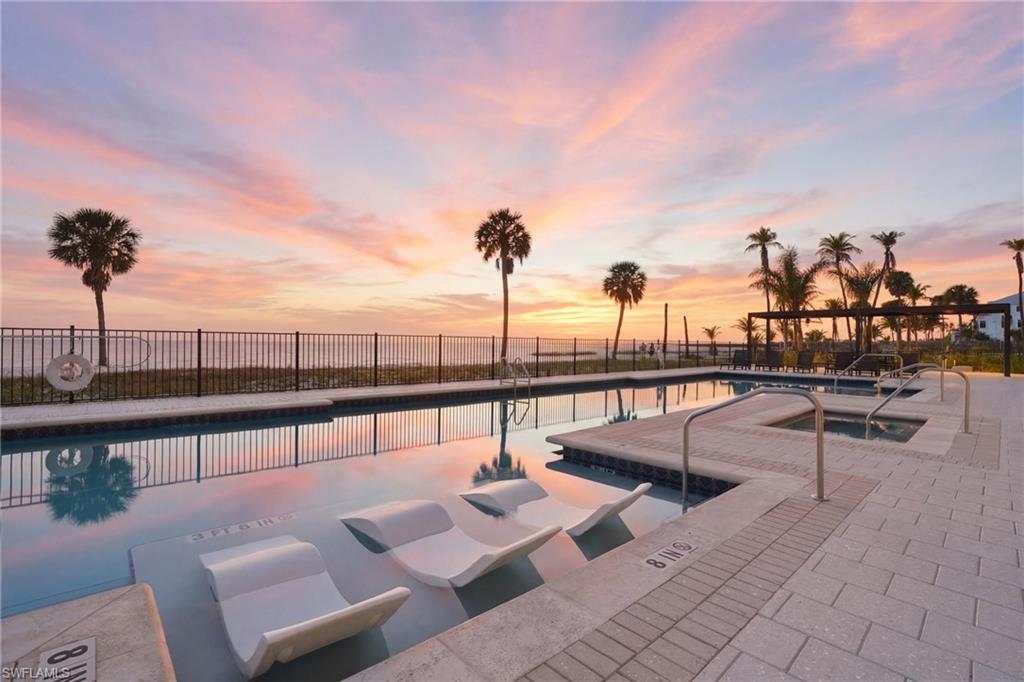 Introducing Residence 101 at Gulfside Twelve, where the scale and privacy of a beachfront estate meet the ease of an exclusive boutique condominium lifestyle. Encompassing approximately 4,000 square feet of interior living space, this exceptional first-floor residence is further distinguished by an extraordinary 1,100-square-foot Gulf-front lanai—a signature feature reserved for Gulfside Twelve’s limited collection of first-floor homes.

Designed for effortless indoor-outdoor living, the expansive lanai becomes a true extension of the residence, offering generous space for dining, lounging, and entertaining against a backdrop of sweeping Gulf of Mexico views.

Inside, a sophisticated coastal palette by South Interior Studios is expressed through wide-plank European White Oak flooring from the Silvian Collection in the Taivas – Sky finish, large-format Imperial Onyx White and Atlas Concorde Fray porcelain tile, and thoughtfully layered architectural millwork. Millwork 360 Plantation Series doors, Smith & Deshields trim, Emtek hardware, and curated designer lighting create a refined sense of craftsmanship throughout.

At the heart of the home, the chef’s kitchen balances clean-lined design with exceptional functionality. Custom cabinetry is paired with Pompeii quartz surfaces in Regalo and Calacatta Estremo and a full Thermador appliance suite, including a 36-inch Pro Harmony gas range, paneled refrigeration, wall oven, microwave, and custom-panel dishwasher. A concealed walk-in pantry, Hansgrohe fixtures, and a beautifully appointed wet bar with beverage center and gourmet ice maker elevate both everyday living and entertaining.

The open great room is anchored by a dramatic 74-inch Amantii Symmetry bespoke electric fireplace, while expansive impact-resistant sliding glass doors frame the Gulf and open seamlessly to the oversized lanai.

The primary suite offers a serene private retreat with spa-inspired finishes, Calacatta Estremo quartz vanities, and an oversized walk-in shower with bench. Three additional guest suites, each with a private bath, provide exceptional comfort and privacy, while a flexible media room or office adds versatility for modern coastal living.

Additional features include private elevator access directly into the residence, 9.5-foot ceilings, a dedicated laundry room, two secure garage parking spaces, smart-home-ready technology, and lighting selections from Visual Comfort, Hudson Valley Lighting, and Savoy House.

Gulfside Twelve is an intimate beachfront enclave offering approximately 180 feet of private beach access, a resort-style pool with cabanas and grilling areas, lush tropical landscaping, and secure private parking. Ideally positioned on the south end of Fort Myers Beach, the residence is moments from Lovers Key State Park and Estero Bay, while the dining, shopping, and entertainment of Fort Myers Beach, Bonita Springs, and Naples remain within easy reach.