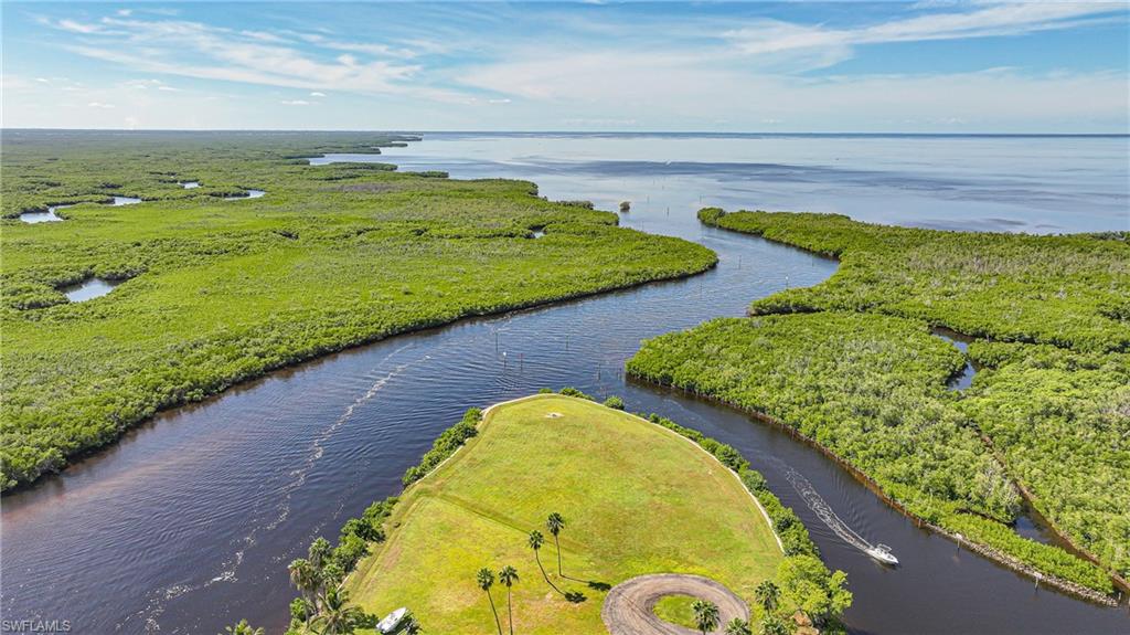 Rare opportunity to own one of Punta Gorda’s premier homesites in the only gated waterfront community in town. This spectacular property sits at the end of Sea Edge Drive, and boasts more than 700 feet of waterfront and approximately 1.49 acres of vacant upland. Build your dream home and enjoy 270° views of Alligator Creek and Charlotte Harbor, both sunrise and sunset exposure, and incredibly fast boating access to open water. Downtown Punta Gorda, Fishermen’s Village, restaurants, shopping, golf, and the airport are all just minutes away. Don’t miss this opportunity to own a truly exceptional property.