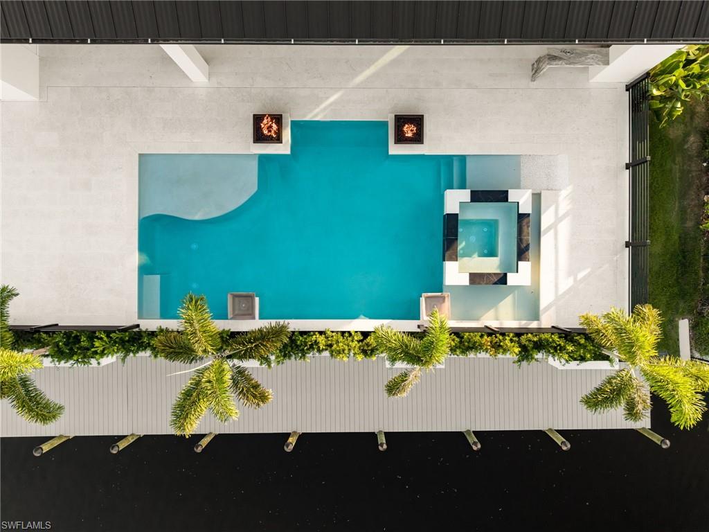 MUST-SEE NEW CONSTRUCTION WATERFRONT HOME WITH DEEP-WATER, DIRECT GULF ACCESS, CUSTOM POOL & DESIGNER FINISHES!

If you are searching for a luxury Fort Myers waterfront home with direct Gulf access, this brand-new residence at 111 Montrose Drive deserves to be at the top of your list. Designed for boating, entertaining, and effortless Southwest Florida living, this 3-bedroom + den/optional 4th bedroom, 3.5-bath home combines deep-water access, exceptional craftsmanship, and high-end finishes throughout.

Inside, soaring 11'-12' ceilings, oversized designer tile, custom lighting, and walls of 10' sliding glass doors create a bright, open layout with impressive views toward the lanai, pool, and water. The great room features a dramatic floor-to-ceiling tiled fireplace wall, illuminated custom shelving, and expansive glass doors that open the home completely to the outdoor living space.

The gourmet kitchen is a standout with extensive custom cabinetry, a large center island, butler's pantry, and premium Thermador appliances including a 6-burner gas range with griddle, double wall ovens, oversized refrigerator/freezer, wine and beverage refrigeration, ice drawer, and more.

The primary suite feels like a private retreat with custom illuminated ceiling details, separate walk-in closets, direct lanai access, and a spa-inspired bathroom with oversized shower, soaking tub, dual vanities, and dedicated makeup area. Each guest suite includes a private bath and walk-in closet.

Outside, the home delivers the Florida lifestyle buyers are searching for. Enjoy an expansive covered lanai with wood-paneled ceilings, outdoor fireplace, and full summer kitchen, plus a custom saltwater pool and spa with fire features, cascading water bowls, and extensive landscape lighting.

Boaters will love the DEEP-WATER, DIRECT GULF ACCESS, allowing you to step from your backyard onto your boat and head out for fishing, cruising, island hopping, or waterfront dining throughout Southwest Florida.

Additional features include a 3-car garage, whole-home generator, tankless water heater, 500-gallon propane tank, professional landscaping, paver driveway, and an extensive list of custom upgrades.

For buyers searching Zillow for a new construction Fort Myers waterfront home, luxury Gulf-access property, deep-water boating home, pool home with outdoor kitchen, or Southwest Florida luxury residence, 111 Montrose Drive offers a rare combination of location, design, boating, and lifestyle.

THIS HOME NEEDS TO BE SEEN IN PERSON. Schedule your private showing and experience the craftsmanship, waterfront setting, and luxury details that make 111 Montrose Drive truly stand out.