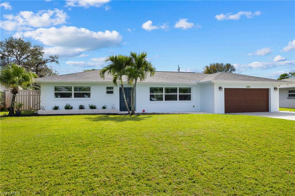 This is a classic and clean modern feeling one-story home that has been extensively, thoughtfully, and lovingly updated in an A++ location. All living areas on the same level … no up’s, down’s, or interior steps. Consistently well cared for over time inside and outside, large manicured lot, big open south facing fenced in backyard. High and dry, no storm surge or flooding, no wind damage, no insurance claims, sought after hard to find ”X” zone. No HOA. All rooms in the home are generous sizes with terrific natural lighting throughout. New roof with new 6” gutter system around entire perimeter (2021), new air-conditioning (2023), all windows and sliders replaced with high impact PGT glass (2019), all exterior doors and garage door replaced (2019), all new wire pulled to electrical panel and electrical panel replaced (2019), new high end HTP 80 gallon water heater replaced (2018), quartz kitchen surface with waterfall edge, all interior doors and baseboards replaced (2019), master bath renovated, front door with sidelight and laundry room side door replaced both are impact rated, impact rated garage door installed and motor replaced, overhead LED lighting installed, backyard LV lighting, installed irrigation system including electronics and below ground irrigation lines (2019), kitchen updated, and lots more great functional and practical touches. This home has a great open feeling yet has clearly defined rooms and spaces … lives fantastically. Superb floor plan with large living room and separate family room plus formal dining area are the beginning of what this 3 bedroom, 2.5 bath home with large 2-car garage that can accommodate large SUV like Suburban or Yukon XL or full-size Escalade plus sedan or minivan. Family room currently utilized as a generous office / flex area. Large laundry room, home is generator ready, uniform large tile flooring throughout residence. Location is amazing … just across US 41 from Park Shore, bike to Clam Pass Park or Seagate beach accesses, close to Sea Gate Elementary School, close to Waterside and Venetian Village, almost equidistant to Mercato and 5th Avenue South, conveniently close to anything and everything you may need or want day-to-day and then some. Sought after school districts. The pictures give you a strong sense of what this home offers but seeing it in person is even better … come for a visit. If value and location are important to you then you do not want to miss this home.