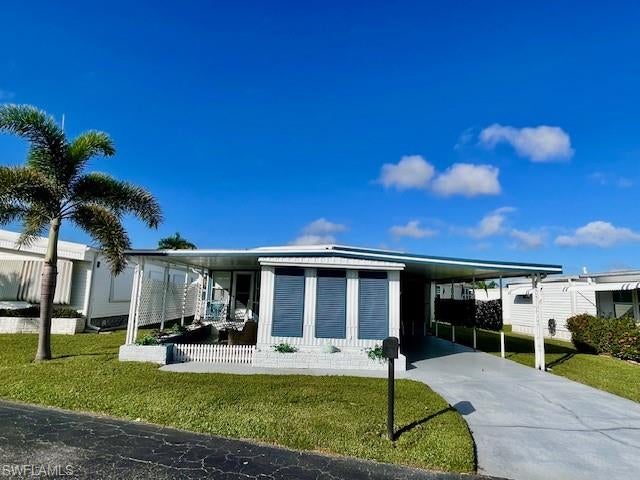 Coastal charm and easy Florida living await! This inviting 2-bedroom, 2-bath manufactured home offers 840 square feet of bright, cheerful living space on a quiet street in Thunderbird Mobile Home Park, a resident-owned 55+ community where you own both the home and the lot.

Renovated after Hurricane Ian, the home features a colorful coastal aesthetic, ceiling fans, mini-split air conditioning, a new dishwasher, spacious kitchen and dining room, plus other appliances approximately two years old. Tasteful furnishings, Florida-inspired décor, and distinctive artistic touches create a welcoming atmosphere. Furnishings are negotiable, offering added flexibility for your move. The bedrooms are at each end of the home, allowing for more privacy.

Enjoy the screened room, outdoor seating area, covered carport, and 12' x 12' storage area. Clean and move-in ready, this charming property is ideal as a year-round residence or seasonal retreat.

Located approximately 2.5 miles from Fort Myers Beach, with convenient access to shopping, dining, golf, and parks. Community amenities include a pool, party pavilion, horseshoes, shuffleboard, bocce ball, clubs, and regularly scheduled social events. With land ownership included and a low HOA fee of $100 per month, this home offers an appealing opportunity to enjoy Southwest Florida living.