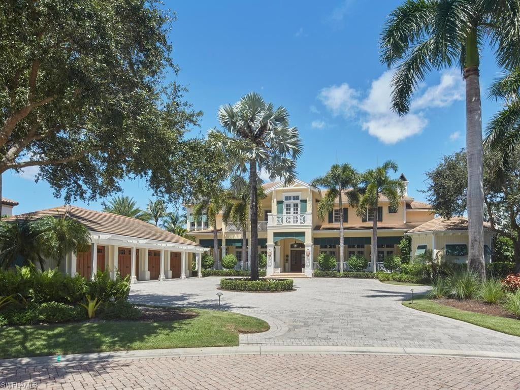 This impressive West Indies–style estate, designed and built by London Bay in 2009, is ideally situated on a private cul-de-sac in one of Grey Oaks’ most exclusive neighborhoods. Set on approximately .85 acres, the expansive property showcases spectacular lake and golf course views and offers 8,423 square feet of air-conditioned living space. Filled with natural light, the thoughtfully designed floor plan features five bedrooms, six full baths and one half bath, along with a private study that could serve as a sixth bedroom. Three guest bedrooms enjoy direct access to private balconies. Spacious living areas include a great room, formal dining room, family room, butler’s pantry and dining nook. Refined finishes include Crema Maya marble flooring throughout the main living areas and kitchen, as well as bamboo wood flooring in the dining room and second-floor gallery. Multiple outdoor living destinations provide an exceptional setting for relaxing and entertaining, highlighted by a beautifully designed negative-edge pool and spa overlooking the expansive lake and golf course views. Additional features include a four-car air-conditioned garage, a generator, electric tankless water heaters, a Lutron lighting system, motorized storm shutters and screens, and newly refreshed landscaping in both the front and rear yards.