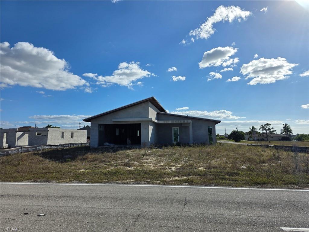 This residential property offers an incredible shortcut for your next project, as both the block walls and the roof construction are already completed. With building plans included, you can bypass the most labor-intensive structural phases and move directly into the finishing stages. Located in a high-growth area of Cape Coral, this site is perfectly positioned for a builder or homeowner looking to significantly reduce their construction timeline. Can be purchased with the adjacent property at 2908 Embers Pkwy W.
