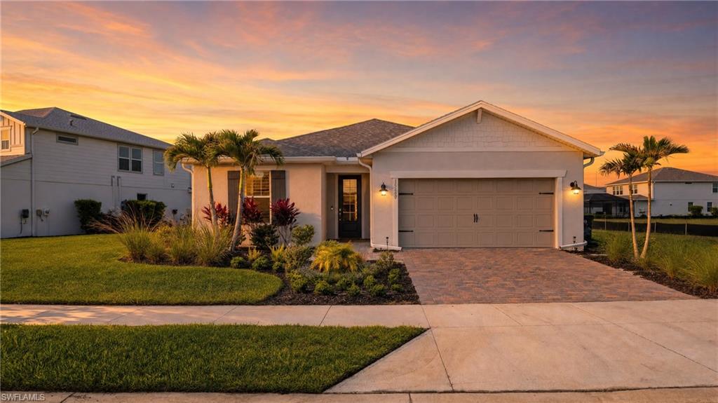 Every evening, the sun dips over the lake and paints the sky in gold — and from this west-facing Northridge home, you have a front-row seat. This meticulously upgraded 3-bedroom, 2-bath home in Babcock Ranch delivers the Florida lifestyle in full: a custom saltwater heated pool with elegant swan water features, an extended lanai with automated blinds and extra sliders from the dining room, and privacy hedging around the pool sides so your outdoor retreat is truly your own. Step inside and the craftsmanship is immediately evident. Zero corner sliders open the great room to the outdoors, while board and batten accent walls and a designer feature wall add architectural character rarely found at this price point. The built-in kitchen package anchors the heart of the home with a gas cooktop, herringbone backsplash, and a whole-house water filtration system with a dedicated drinking water spout at the island. Luxury vinyl plank runs throughout — not a square foot of carpet — and plantation shutters dress every room. The primary suite features a spa-style shower with tile carried all the way to the ceiling. Automated window coverings on the sliding doors and front door, plus manual blinds on the lanai side, mean every level of light and privacy is at your fingertips. Practical upgrades round it out: impact windows and doors, a deep tandem garage, a whole-house water filtration system, and an electric pool heater that keeps operating costs predictable year-round. Location within Babcock Ranch doesn't get much more convenient than Northridge — just minutes from Founders Square, Yellow Pine, and Crescent B Commons, with one of the easiest exits out of the community for commutes and day trips. And then there's Babcock Ranch itself: America's first solar-powered town, built for everyone. Whether you're a young family, a remote worker, an active retiree, or simply someone who wants to live somewhere intentionally designed for a great life — Babcock Ranch has a place for you.