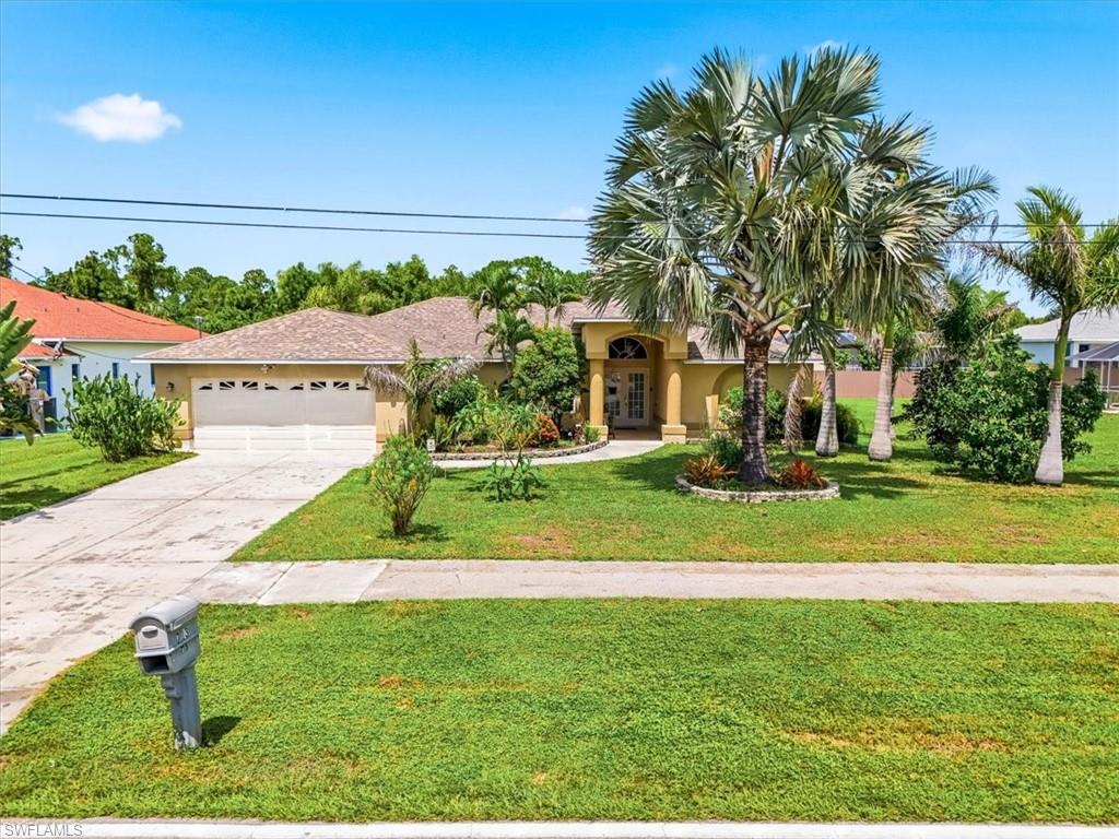 Welcome to 713 Milwaukee Blvd, Lehigh Acres, FL 33974! This spacious 3-bedroom, 2-bath saltwater pool and spa home offers 2,036 SF of comfortable living space in the Mirror Lakes area of Lehigh Acres, with the bonus of being on central water and sewer. Designed for both everyday living and entertaining, this home features a split-bedroom floor plan, vaulted ceilings, tile flooring, and separate living and family areas. The generously sized kitchen offers upgraded granite countertops, stainless steel appliances, an island, breakfast bar, pantry, and an abundance of cabinetry and workspace. The oversized primary suite includes two walk-in closets, private access to the lanai, and an impressive en-suite bathroom with a large tiled walk-in shower. Don't miss the expansive covered lanai, screened pool and spa, providing an inviting setting for entertaining or enjoying the Southwest Florida lifestyle. Additional highlights include an indoor laundry room, two-car attached garage, central water and sewer, and no HOA fees. Conveniently located near schools, Veterans Park and Recreation Center, and shopping. SELECT PHOTOS HAVE BEEN VIRTUALLY STAGED OR DIGITALLY ENHANCED.