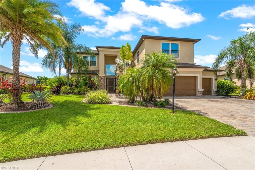 Priced to sell!!!! Welcome to Portico, one of Fort Myers’ most desirable gated communities! This spacious two-story home offers an impressive 3,464 square feet of living space with 6 bedrooms, 3 bathrooms, and a 3-car garage, providing room for everyone. A dedicated movie theater creates the perfect space for family movie nights or entertaining guests.
Step outside to a large fenced backyard overlooking the lake, with plenty of room to design and build your dream pool while enjoying peaceful water views. The kitchen offers all you would expect with stainless appliances, granite counter tops and loads of cabinet space. The master bedroom is huge offering a private sitting area and an amazing master bath which includes a soaking tub plus a large walk in shower. Portico offers an outstanding lifestyle with resort-style amenities including a community pool, clubhouse, fitness center, pickleball courts, tennis courts, basketball court, playground, and sidewalks throughout the neighborhood. Conveniently located near schools, grocery stores, banks, the library, shopping, dining, and more, you’ll enjoy easy access to everything you need.  This exceptional home combines generous living space, modern amenities, and an unbeatable community lifestyle-making it the perfect place to call home. Call today to schedule your showing!!