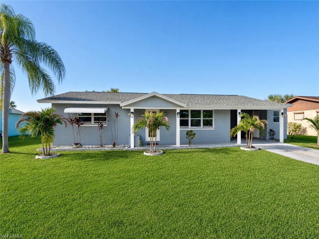 Newly remodeled 2 bedroom 2 Bath in Popular Wedgewood Subdivision. NO HOA FEES here. CENTRAL WATER AND SEWER AND WALKING DISTANCE TO PUBLIX AND OTHER STORES ETC ON HOMESTEAD RD, located just minutes to I-75, Ft Myers and SWFL International Airport, NEW DIMENSIONAL SHINGLE ROOF IN 2023, NEW WATER HEATER IN 2025, bathrooms and kitchen have been recently remodeled, ceramic tile floors throughout, freshly painted inside and out, newer insulated windows, newer Square D Electrical panel box, 15 X 10 screened lanai overlooks the FENCED BACKYARD with a canal in the rear for privacy and fishing, storage/utility room located off of the carport, NO FLOOD INSURANCE REQUIRED. LEHIGH IS THE HIGHEST ELEVATION IN LEE COUNTY.