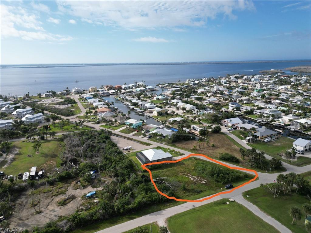 Property Overview
Location: Near the heart of Saint James City (southern tip of Pine Island, Lee County, FL)

Setting: Laid-back boating/waterfront community in a quiet neighborhood near a pocket park

Lot Size: Oversized prime residential lot

Dimensions: 112' × 174' × 102' × 130'

Condition: Mostly cleared

Utilities & Infrastructure
Water: Water available at site

Connection Fee: $4,773.00 utility connection fee

Elevation: Approx. AE-EL8 (NAVD88)

Construction & Development
Building Assessment: Home assessment for stem wall construction available from a premier builder
Parcel Info
https://share.google/5gVvAKVThSuUWQJNe
Zoning Info 
https://share.google/b78s69VIEbgpJpCui