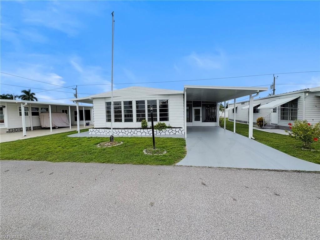 Now available! Double-wide manufactured home with two bedrooms and two bathrooms, move-in ready! 55+ and pet-friendly, newer roof and carport plus other brand new upgrades which include all new luxury vinyl plank flooring, interior and exterior paint, electrical, plumbing and cabinetry repairs and updates! Located in Tamiami Village, a 55+ community with many amenities, including three heated swimming pools, two clubhouses, pickleball, shuffleboard, a fitness center, billiards, a library, a dog park, and many activities and social events. Located in North Fort Myers, near Downtown Fort Myers, which offers waterfront dining, entertainment, shopping, live music, a library, and specialty shops.