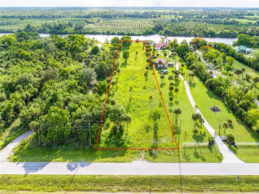 Discover the perfect blend of privacy, beauty, and convenience at 5220 Ft. Denaud Road. This exceptional 3± acre riverfront property offers approximately 160 feet of frontage on the breathtaking Caloosahatchee River, part of the Intracoastal Waterway. High and dry with no flood insurance required, the property boasts stunning panoramic water views and an elevated homesite ideal' for your dream estate.
Unlike many riverfront properties, your view across the river is protected by a sprawling 300± acre orange grove rather than neighboring homes, creating a peaceful and picturesque setting rarely found today. The land  has been lovingly underbrushed while preserving the maximum number of mature trees, offering privacy, natural beauty, and a tranquil old Florida atmosphere.
With approximately 160 feet of frontage on coveted Ft. Denaud Road and located just one-half mile from State Road 80, this property combines  secluded country living with quick and easy access to both Florida coasts.  Conveniently situated only 4 miles from the Lee/Hendry County line, you are close to shopping, dining, and amenities while still enjoying the  serenity of riverfront living.
No HOA fees or deed restrictions mean exibility and freedom. Outbuildings and fencing are permitte subject only to zoning requirements, so bring your RV, boat, and all your recreational toys. Property will require installation of a well and septic system. To slope the riverbank or add a doc, permitting is easily obtainable through Hendry County and the US Army Corp of Engineers.
A rare opportunity to own a private waterfront retreat in one of Southwest Florida's most desirable riverfront corridors.