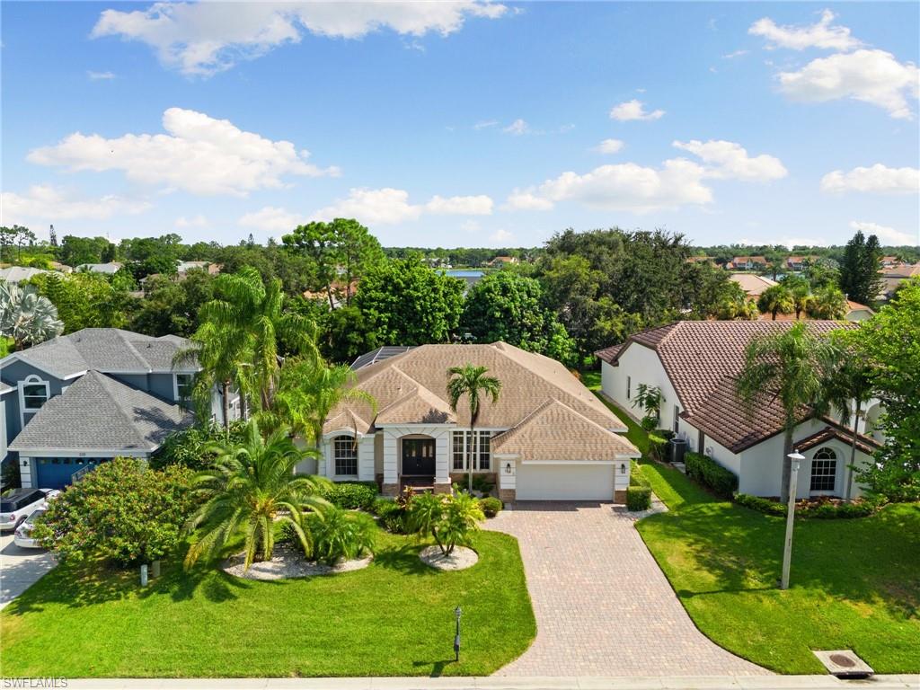 Turnkey furnished and newly updated! This beautiful 4 bedroom 3 bath home in the heart of Naples offers an exceptional combination of style, comfort, and location. The kitchen has been beautifully updated with brand new granite countertops, a butcher block island, and new kitchen hardware, creating a fresh and inviting centerpiece for the home. Designed for easy Florida living, the home features high-volume ceilings, a new AC unit (2025), spacious open split-bedroom floor plan, and an expansive screened-in lanai and pool with privacy screens and a new pool heater for year-round enjoyment. The primary suite features updated luxury flooring, a comfortable sitting area, dual vanities, and a large walk-in closet. While three well-appointed guest bedrooms feature updated flooring and are served by two full guest bathrooms. One of the guest bathroom serves also as a convenient pool bath. Further, the home presents an elegant formal dining room providing an ideal space for entertaining. Additional updates include new landscaping, a new laundry room tub, new garage door, and fresh interior and exterior paint. Electric hurricane shutters offers privacy and protection on the lanai, while a long brick-paver driveway enhances the home’s curb appeal. Located in Berkshire Lakes, residents enjoy a community pool, tennis courts, clubhouse, and social activities, all with one of the lowest HOA fees in Southwest Florida. Perfectly positioned near iconic Naples’ 5th Avenue South, Third Street South, Mercato, premier golf courses, shopping, restaurants, and beaches. This turnkey home is an excellent opportunity to enjoy the Naples lifestyle in a desirable central location. Come experience this wonderful home and all it has to offer.