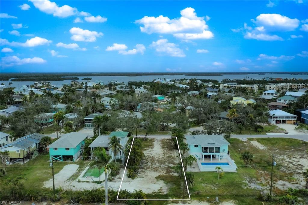 Build Your Dream Coastal Oasis: Steps to the Sugar Sands!

Rare opportunity to own a premium, cleared 6,882 sq. ft. residential lot (50' x 138') in the highly desirable mid-island neighborhood of McPhie Park. putting the pristine ocean front of the Gulf of Mexico just a short stroll from your future front door.
Perfect for a custom luxury residence or a lucrative weekly vacation rental investment, this RS-1 zoned lot allows flexible building options. Take advantage of Fort Myers Beach’s updated zoning rules to design a stunning, elevated home engineered for maximum coastal resilience. Public water and sewer hookups are available making this site completely shovel ready.
Enjoy unparalleled convenience, located slightly a mile from the shopping, dining, and boating at Santini Plaza and Fish-Tale Marina. Don't miss one of the best-priced vacant lots on the island. Secure your piece of paradise and start building today!