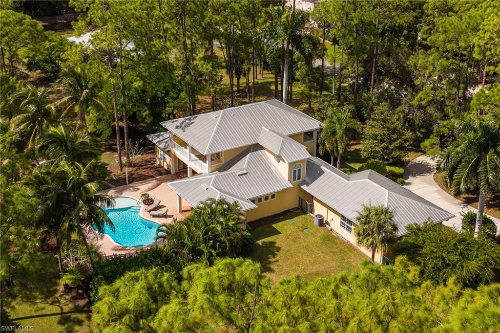 Olde Florida charm. Offering 4 bedrooms and 3,723 square feet of living space, the residence features a den and flex room, along with 4.5 baths including a brand-new primary suite remodel completed in 2026. Enjoy abundant storage and parking with an attached 3-car garage and an additional 1,800 square feet garage/shop—ideal for projects, hobbies, or extra space.  

The gourmet kitchen is designed for the chef and built for entertaining, featuring GE Monogram and Profile appliances, a 42-inch Sub-Zero refrigerator, double wall ovens, an elegant cooktop, dual sinks, a small island with breakfast bar seating, and a spacious walk-in pantry. The main level offers a comfortable, functional layout with a private primary suite, dedicated office, welcoming living room, open family room, powder bath, stunning eat-in kitchen, and a formal dining room for everyday living and special occasions.  

Upstairs, the primary suite includes two walk-in closets, a separate shower, and a luxurious soaking tub. The second level is finished with durable, stylish luxury vinyl flooring. Step outside through three sets of French doors to an entertainer’s paradise with a paver patio, sparkling pool and spa, and a full outdoor bath, all surrounded by lush landscaping and a well-fed irrigation system for year-round enjoyment. With multiple living spaces, thoughtful details, and true Southern charm, this home offers character, privacy, and luxury in every corner.