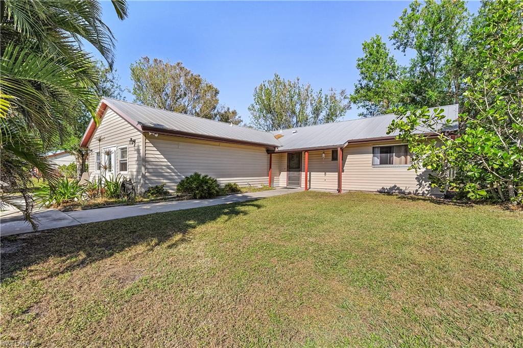 Lovely 3 bedroom 2 bath home on 1.25 acres and zoned AG-2. Home has all new luxury vinyl flooring, carpeting and new kitchen appliances plus new central A/C. Wind rated sliding glass door, new wood kitchen cabinets, beautiful granite counter tops and wide open floor plan. Enclosed front room (approximately 480 sq. feet) that adds so much value for all of the options it provides, ie. storage, another living area, bedroom, workout room, etc. There is also a detached 1 car garage with power that also offers so many possibilities. Fenced area out sliding glass door in case you have pets. Make your appointment TODAY to see your new home.