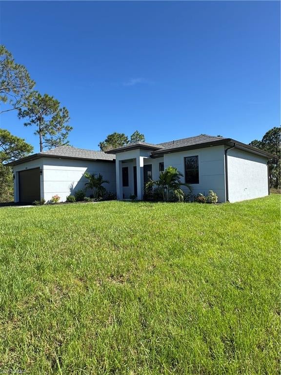 . New construction with many upgrades included built in closets, entertainment unit in living room, the house have the osmosis reverse water system ,impact doors and windows,asphalt driveway