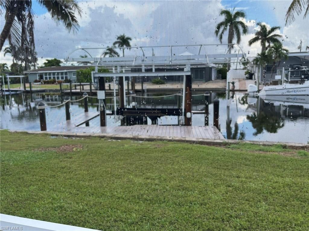 NEW TO THE MARKET TOTALLY REMODELED GULF ACCESS CANAL HOME W/ 2 BEDROOMS PLUS DEN/FLEX ROOM, 2 FULL BATHROOMS AND A 2 CAR GARAGE. Ready to move in and make it your own! FULL SUITE OF LUXURY SAMSUNG STAINLESS STEEL APPLIANCES, TANKLESS HWH, COVERED BOAT DOCK/LIFT, NEW WINDOWS, DOORS FLOORS & MORE! FAIRVIEW ISLES is a popular and vibrant waterfront boating community located on the south end of lovely Fort Myers Beach, Florida. Covered patio with a screened lanai overlooking canal with covered boat dock/lift, room for a pool/spa. Close to Beach, Gulf, Santini Plaza & Marina, Restaurants, Shopping, Farmers Market, Coffee & Ice Cream shops, Trolley Stop and easy access to Bonita Springs, Estero, Naples, RSW airport, I-75, Hertz Arena, & more.