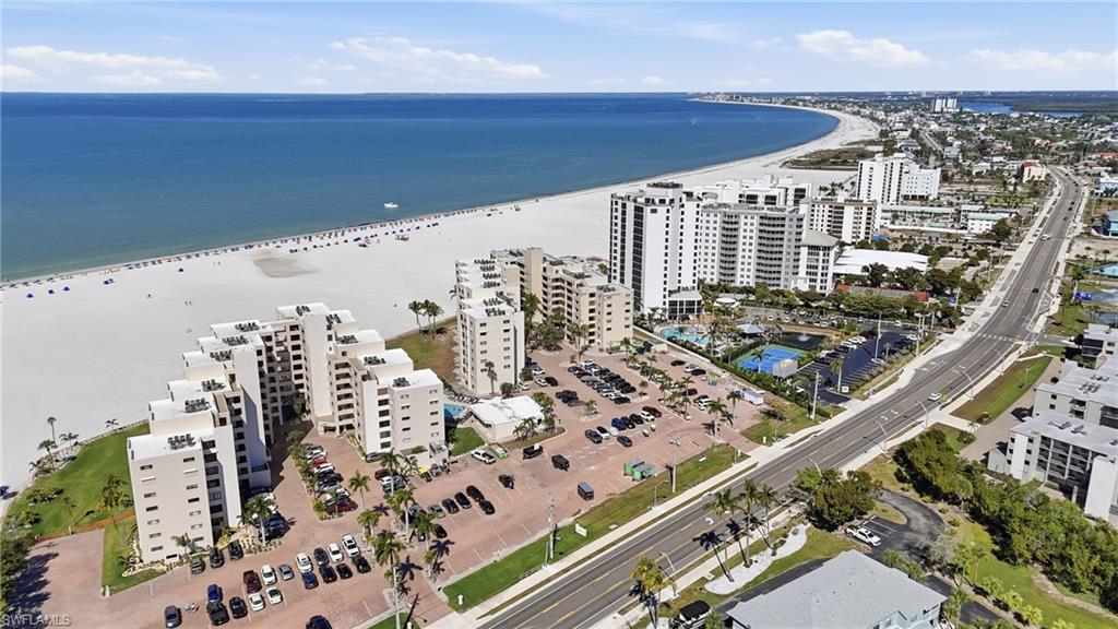 Experience coastal living at its finest in this BEAUTIFULLY RENOVATED 4th-floor CORNER UNIT, ideally situated on the desirable south end of Fort Myers Beach. Offering 2 bedrooms and 2 bathrooms, this immaculate TURNKEY residence combines modern updates, an open-concept design, and breathtaking views of the Gulf of Mexico. The bright and spacious living area features NEW TILE FLOORING THROUGHOUT, an inviting eat-in kitchen, and an abundance of natural light that enhances the home's fresh, coastal feel. The glass-enclosed lanai provides additional living space and the perfect setting to relax while overlooking the sparkling community pool and beautiful Gulf waters. Enjoy spectacular SUNSET VIEWS from the comfort of your own condo as the evening sky transforms over the Gulf. Thoughtfully updated, exceptionally clean, and beautifully maintained, this residence is ready for immediate enjoyment. Located just steps from the WORLD-FAMOUS WHITE SAND BEACHES of Fort Myers Beach and within walking distance of shopping, dining, and nightlife, this exceptional property offers the perfect combination of convenience, comfort, and coastal charm. Whether you're seeking a seasonal retreat or a full-time residence, this move-in-ready condo delivers the Southwest Florida lifestyle you've been looking for.