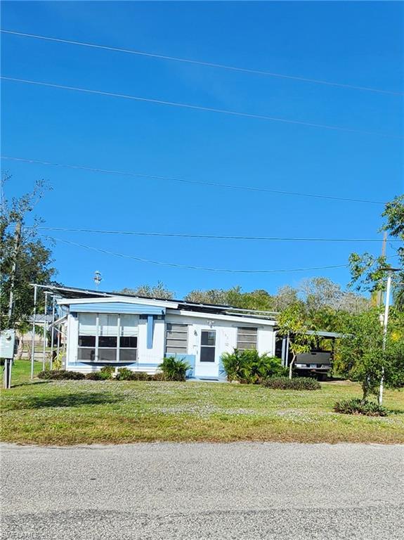 FISHERMAN'S DREAM! Riverfront with home for only $190,000!  Seller says "Bring me an Offer" This property fronts on the Caloosahachee River and on a canal in the back yard with boat ramp and dock.  The 2/1 well built, well maintained mobile home has an addition with murphy bed and 1/2 bath.  The back patio is under roof and houses the solar water heater, solar panel equipment and workshop filled with tools, in addition to the hot tub.  There is currently an $800 credit towards electric expense due to the solar panels being so efficient.  The shady back yard includes a boat ramp, dock, and fire pit, everything you need. Call today for your appointment! Seller wEill finance up to $100,000 at 3.5% interest for 10 years.