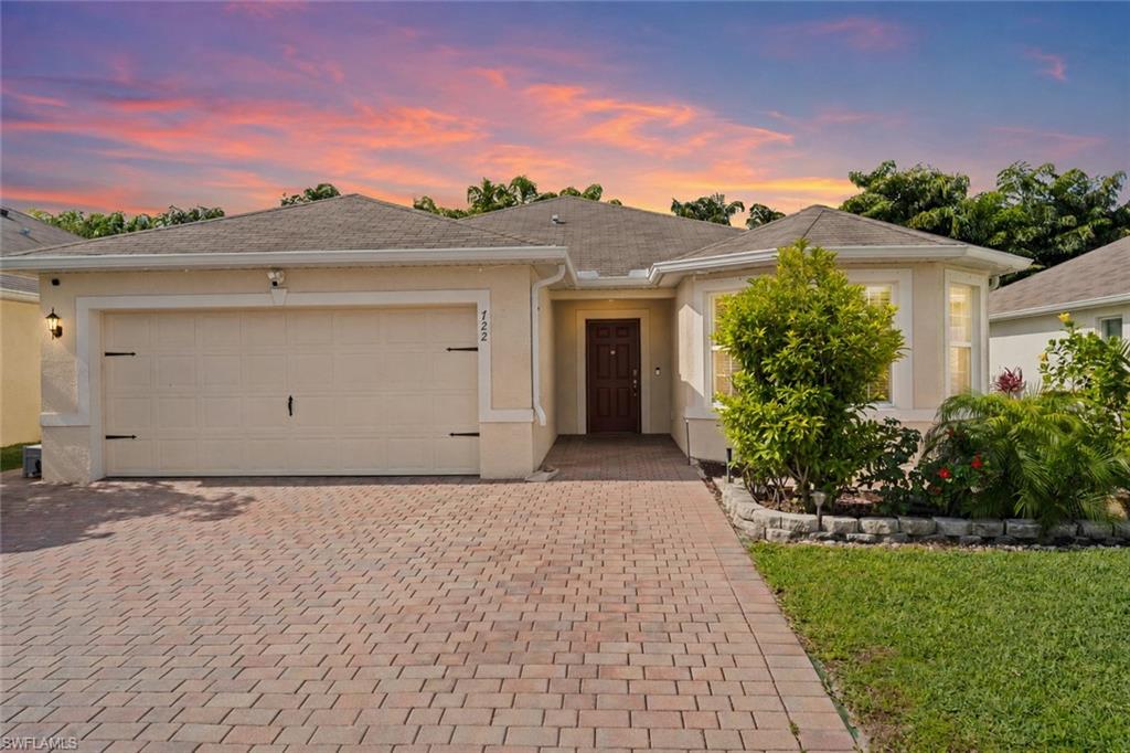 One or more photo(s) has been virtually staged, AI generated or rendered.  Positioned within the welcoming enclave of Hadley Place, this newer-construction residence offers the ideal blend of comfort, convenience and the Naples Florida lifestyle appeal. Rarely available and highly sought-after, the Eastham floor plan is the largest 3-bedroom, 2-bath layout in the community, thoughtfully designed to maximize living space with today’s modern buyer in mind. Built in 2020, the home features a bright open-concept design that seamlessly connects the kitchen, living and dining areas, creating an inviting atmosphere ideal for both everyday living and entertaining. The well-appointed kitchen showcases warm wood cabinetry, granite countertops, stainless steel appliances, a spacious pantry and a thoughtfully positioned breakfast nook that allows for effortless access to the kitchen’s amenities. Surrounded by inviting natural light streaming through the bay window bump-out feature—unique to this floor plan, the dedicated nook space creates the perfect setting for casual morning coffee or relaxed dining. The private owner’s suite serves as a relaxing retreat, offering tranquil backyard views highlighted by tropical fruit-bearing trees, an oversized walk-in closet and a spacious en-suite bath with dual sinks. Two additional bedrooms provide flexibility for guests, a home office or growing families. Outdoor living is equally impressive. With no rear neighbors, the home enjoys enhanced privacy along with a highly desirable southern rear exposure, ideal for maximizing natural light and offering excellent potential for a future pool. Additional highlights include full hurricane shutter protection, a two-car front-load garage and a widened paver driveway with added overflow parking space. Residents of Hadley Place enjoy a quiet, pet-friendly community with low HOA fees, favorable leasing policies and convenient access to Naples’ premier shopping, dining, entertainment and everyday conveniences, along with quick connectivity to I-75 for effortless commuting throughout Southwest Florida. This exceptional property presents a rare opportunity to own a spacious newer-construction home in one of Naples’ most conveniently located and desirable areas. Home is being offered unfurnished. Some images have been digitally enhanced to illustrate possible room layouts and furnishing arrangements.