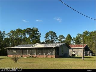 7.11 Acres • Not located in a wetlands overlay area • Flood Zone X • Drive-Through Pole Barn
Room to spread out with privacy, usable acreage, and space for just about everything! This 1986 double-wide manufactured home offers 3 bedrooms, 2 baths, and 1,404 sq. ft. of living area on 7.11 acres, conveniently located just off the main road while still providing a private country setting.
A screened front patio features a poured concrete floor raised to the same level as the home, providing convenient no-step access from the living area to the porch.
One of the property's standout features is the large pole barn with elevated truss height and drive-through access, providing room for tractor-trailers, boats, RVs, tractors, equipment, and other oversized vehicles. Whether you need space for work, recreation, storage, or a combination of all three, this property gives you plenty of options.
With no wetlands and Flood Zone X, the 7.11 acres offer an exceptional amount of usable land. Bring your equipment, toys, animals, and ideas—there's plenty of room here to create the country property you've been looking for while remaining convenient to the main road.