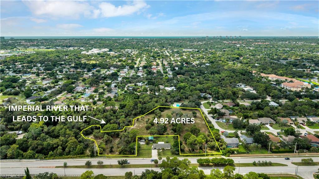 RARE FIND - 4.92 acres! This large parcel is located in one of the fastest growing areas of SWFL. The property still has Old Florida landscaping that sits alongside large cleared areas. Build the home of your dreams on land that gives you a country feel while being on the Imperial River that gives you the ability to soak up the Florida sun while kayaking down the river that is right in your backyard ... plus, it goes ALL the way to the Gulf!