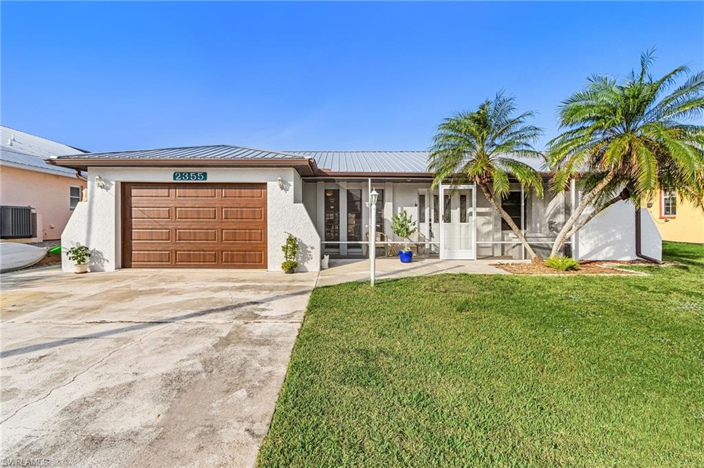 Great Gulf access.  Less than 5 minutes out to San Carlos Bay and then on to the fishing, beaches, and restaurants the area is famous for.  This 2 bedroom 2 bath home has a large family/Florida room on the canal to sit and enjoy the local wildlife.  The kitchen has been updated with white cabinets.  There is a boat lift with the frame for a cover, but no cover.  And a composite dock.  Spacious with lots of storage space.  This home is on a quiet, dead end street.  Perfect for your winter or year round home