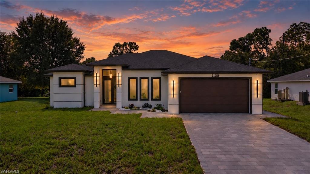 Conveniently located with easy access to both the Buckingham area and the heart of Lehigh Acres, this home combines modern elegance with everyday functionality. The floor plan features an en-suite bathroom in every bedroom, offering privacy and convenience for residents and guests. One bathroom also provides direct access to the extended lanai and outdoor kitchen, ideal for entertaining. Every closet features custom built-in cabinetry for added storage and organization. The kitchen includes upgraded, extra-thick quartz countertops and a built-in wall oven and microwave, maximizing cabinet and counter space. A whole-home reverse osmosis system provides filtered water throughout the property, a valuable upgrade for homes with well water. With its practical layout, upgraded finishes, and indoor-outdoor living spaces, this home is designed for both comfortable living and entertaining.