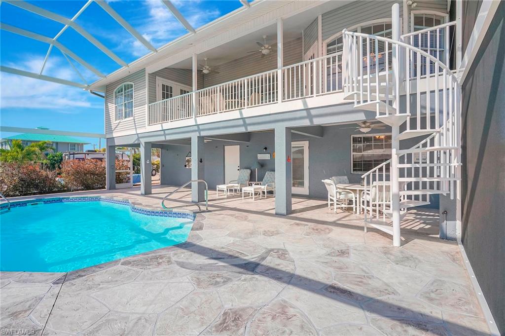 Waterfront Paradise with Direct Gulf Access – Turnkey Home & Investment Opportunity.  Discover your dream canal-front escape in beautiful Bokeelia! This stunning, turnkey property offers direct Gulf access and doubles as an exceptional vacation rental or private retreat. With breathtaking water views and quick access to Charlotte Harbor and the Gulf of America, this home is a boater’s paradise!

Included with the sale is a 2018 Sea Hunt Ultra 211, a 21-foot center console powerboat (with 55 hours and new batteries in 2024) and a new lift cover, making it easy to launch into your next adventure.

The main level features 3 bedrooms and 2 bathrooms, while the lower level offers a private, self-contained suite with 1 bedroom, 1 bathroom, a full kitchen, and direct access to the pool and dock—perfect for guests or additional rental income. With room to comfortably accommodate 8+ guests, this home is designed for both relaxation and profitability.

Enjoy the Florida sunshine year-round with a new, expansive pool cage covering the entire back of the home—ideal for outdoor entertaining while soaking in serene canal views. Located just moments from world-class fishing, shelling, and beach hopping, this property puts the best of coastal living at your fingertips.  

Whether you’re seeking a personal waterfront retreat or a proven income-generating rental, this home offers the best of both worlds. Don’t miss this rare opportunity—schedule your private tour today and claim your piece of paradise!