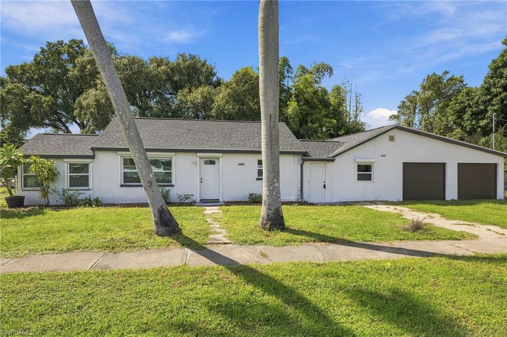 Welcome to this updated single-family home boasting 3 bedrooms, 2 bathrooms, plus a den, and an oversized 2-car garage. The oversized garage is a craftsman or mechanic's dream, offering ample space for all your projects. The interior has been recently updated, giving the home a fresh and modern feel. The interior features granite counters, stainless steel appliances, and beautiful tile flooring throughout. The RV pole barn with power is perfect for storing your recreational vehicle. With a new AC, Hot Water Heater and roof installed in 2025, you can rest easy knowing that your home is in top-notch condition. Recently installed electric roll down hurricane shutters provide the ultimate peace of mind.  The oversized corner lot provides plenty of space for outdoor activities and entertaining. Located just minutes from downtown Fort Myers, you'll have easy access to shopping, dining, and entertainment. Don't miss out on this incredible opportunity to own a beautiful home in a prime location!