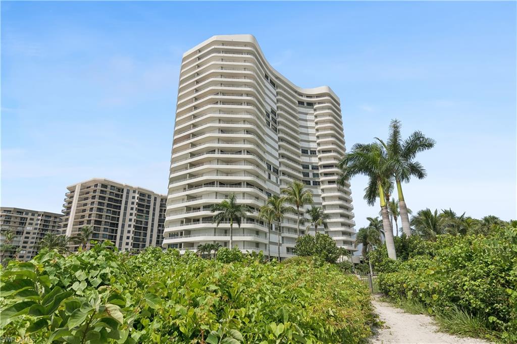 LIVE ON THE BEACH Summit House of Marco Island, upscale complex located on the beach. Gulf front Residence with private path to the beach. VIEWS FACING WEST and NORTH of the beach and gulf, Offering Sunsets and Twinkling City Lights from 890 sq. ft WRAP AROUND BALCONY. Rarely available -3 bedrooms plus 3 bathrooms. Each bedroom has its own bathroom. Immaculate Coastal renovation 2500 sq. ft under air, including flooring, kitchen with granite countertops, Viking Stovetop, Kitchen Aid stainless appliances, bathrooms with granite countertops, IMPACT WINDOWS, IMPACT SLIDERS PLUS SHUTTERS . BONUS 2 Undercover PARKING SPACES Spacious residence, living room, dining room ,eat in kitchen, laundry room with cabinets, wet bar with wine cooler and sink, storage closets, plus extra storage on same floor as residence. Primary Bedroom suite, has two California closets, ensuite bathroom with large oversized walk in shower, dual sinks, water closet and linen California closet. Summit House amenities include a heated pool and spa, SAUNAS, fitness room, social room with billiards, library and kitchen for functions. Secure lobby with manager and staff on duty. DESIRABLE BEACHFRONT LIVING on Marco Island.