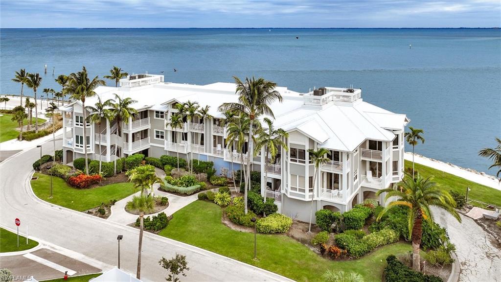 Wake to breathtaking sunrises over Pine Island Sound and toast the evening as the sun melts into the Gulf of Mexico from this stunning waterfront retreat on Captiva Island. This beautifully appointed three-bedroom, three-bathroom condominium feels more like a private luxury yacht than a traditional residence, perched directly on the Sound with panoramic water views. Watch dolphins dance through the shallows, shorebirds glide along the coastline, and sport fishermen venture out at first light. From the spacious open-air balcony, golden sunsets over the Gulf become your nightly ritual. The coveted Seabreeze floor plan lives graciously, with two of the bedrooms featuring its own ensuite bath and direct access to a generous lanai. A complete renovation has just been finished, showcasing premium stainless-steel appliances, elegant quartzite countertops, a charming shiplap breakfast bar, all-new bathrooms with designer mirrors, updated flooring throughout, and windows and doors meeting or exceeding current Florida building standards. Partially furnished with a coastal living and dining collection, this home is truly ready for your personal signature. The surrounding neighborhood offers an unparalleled island lifestyle. Nearby, the Captiva Kayak Launch invites effortless waterfront exploration. With membership, residents enjoy world-class amenities including the Bayview pool complex just footsteps away, a seaside golf course, children's programs, watersports, three waterfront dining destinations, and the Captiva Landing water park. This is more than a home — it is an elevated island lifestyle where every day feels like a getaway. Schedule your private showing today.