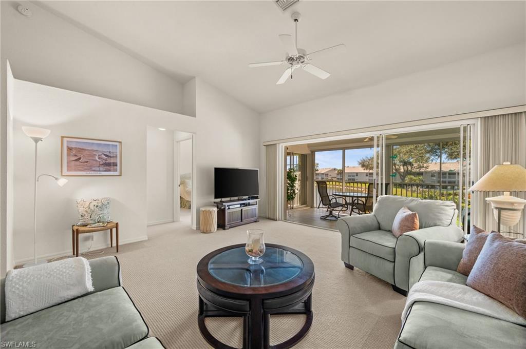 One or more photo(s) has been virtually staged, AI generated or rendered.  Perfect as a vacation home or year-round residence, this gently used property — never rented and owned by only two owners — is offered furnished, presenting the best price opportunity in Bermuda Greens to move right in or customize with your own personal touch. Virtually staged photos show how easily this bright, open layout transforms with a modern coastal flair. Tall vaulted ceilings and abundant natural light greet you as you enter the freshly painted, open floor plan, which includes a sun-filled eat-in kitchen — ideal for your morning coffee. The living area flows to an expansive lanai with new tile, screens, and electric shutters. The primary suite is a private retreat with direct lanai access and a generous walk-in closet. Positioned on a tranquil corner, it offers private sunsets, lake and fountain views, and local bird sightings. Additional features include plantation shutters, newer AC, new dishwasher, a covered carport, and condo fees covering cable, internet, water, sewer, pest control, and more. The well-maintained community, surrounded by lakes and lush greenery, offers a pool, spa, bocce courts, and resident social events. Located in a prime North Naples area, you’ll enjoy easy access to pristine beaches, shopping, and dining. This property offers the perfect setting for those seeking a light-filled home where sunshine, nature, and community come together.