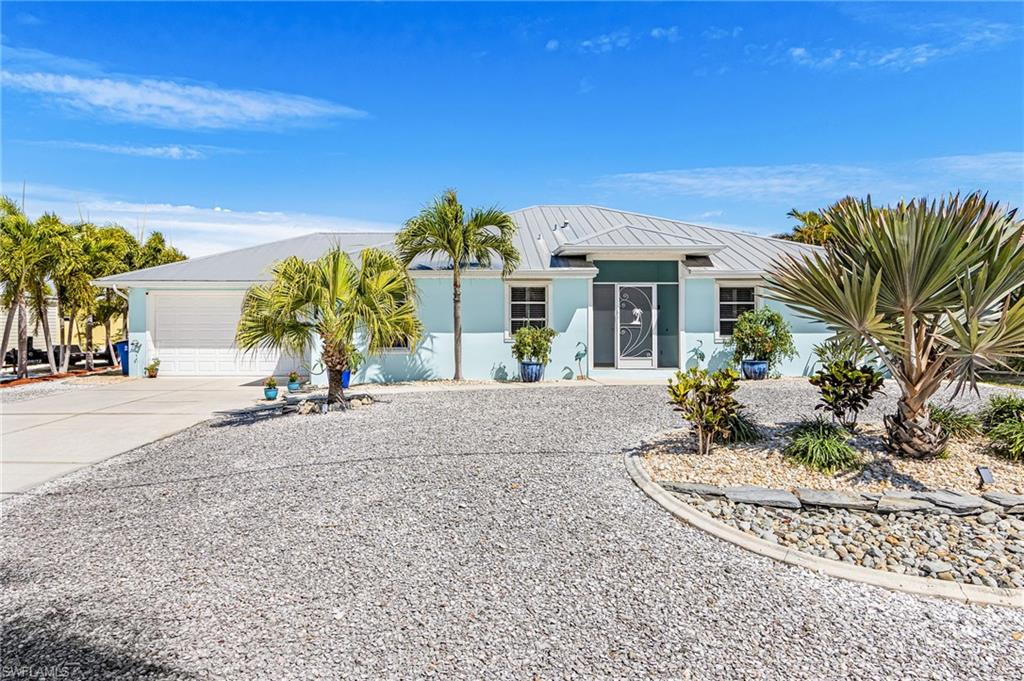 This beautiful POOL/SPA home is furnished and offers 2 bedrooms PLUS a Bonus room and DIRECT WATERFRONT access to the Gulf.  Enjoy spacious, open living areas designed for comfortable coastal living. The kitchen features a large breakfast bar and beautiful décor.

The generous outdoor space offers a heated pool and spa—perfect for enjoying the island lifestyle. A versatile bonus room adds flexibility for a home office, guest space, or hobby area. The well-appointed laundry room offers plenty of storage, and the OVERSIZED  two-car garage adds convenience and ROOM FOR TOYS!!

Built with a durable metal roof and surrounded by carefree island landscaping, this home is designed for easy living. Across the street, a dedicated green space offers ideal boat trailer storage. Just added Flood Gates for peace of mind!!

At the water’s edge, a wrap-around dock with a covered boat lift sits on a deep-water canal, providing quick access to Matlacha Pass and some of the area’s best boating, fishing, and island-hopping. Enjoy nearby destinations like Cabbage Key for a “Cheeseburger in Paradise” or the pristine beaches of Cayo Costa and Picnic Island—all just a short boat ride away. Note: The voluntary HOA provides access to the community boat ramp.