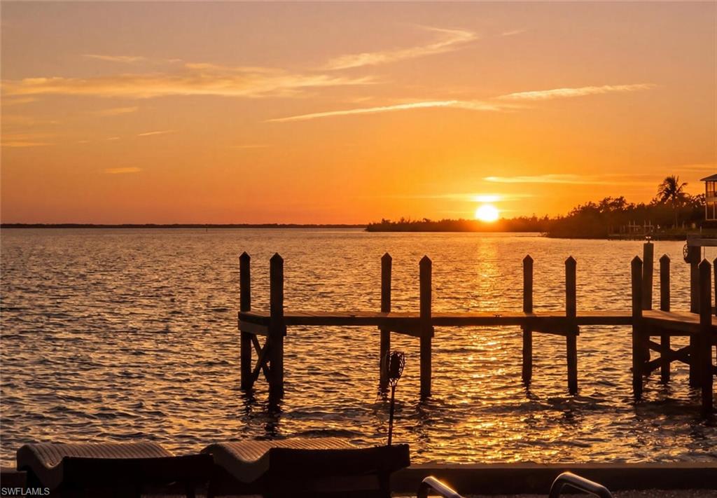 Wake up to this every day... Captiva's Best Value for Buyers Seeking Walkability, Deep-Water Boating, and the Authentic Island Lifestyle.
Imagine beginning each morning with coffee overlooking the sparkling waters of Pine Island Sound as dolphins glide past your private dock and pelicans soar overhead. This is more than a waterfront home, it's a lifestyle that few properties can offer.

Perfectly positioned in the heart of Captiva Village, this exceptional bayfront residence combines expansive, unobstructed water views, direct Gulf boating access, and one of the island's most walkable locations. Leave the car behind and stroll to Captiva's renowned restaurants, charming boutiques, Captiva Chapel by the Sea, the library, local galleries, and the sugar-sand beaches of the Gulf of Mexico. Few waterfront homes offer the rare opportunity to enjoy both a premier boating lifestyle and the convenience of village living.

Set on nearly one-half acre, the property features a private deep-water dock with no bridges to the Gulf, making it an ideal retreat for boating enthusiasts, anglers, and those who simply love life on the water.

Designed to capture the timeless charm of Old Florida, the home offers warm, inviting living spaces where family and friends naturally gather. Spend the day boating to nearby islands, relaxing by the pool, fishing from your dock, or simply watching the ever-changing beauty of Pine Island Sound unfold before you. Evenings are reserved for spectacular sunsets, waterfront dining just a short walk away, and the relaxed pace that has made Captiva one of Florida's most treasured destinations.

Adding to its appeal, the home has enjoyed a successful vacation rental history, providing an exceptional opportunity for buyers seeking both a luxury retreat and income-producing potential.

Whether you're searching for a full-time residence, seasonal escape, or legacy waterfront property, 15153 Captiva Drive represents one of Captiva's most compelling values. Offering an irreplaceable combination of walkability, direct boating access, breathtaking bay views, and authentic island charm, this is the Captiva lifestyle you've been dreaming about!