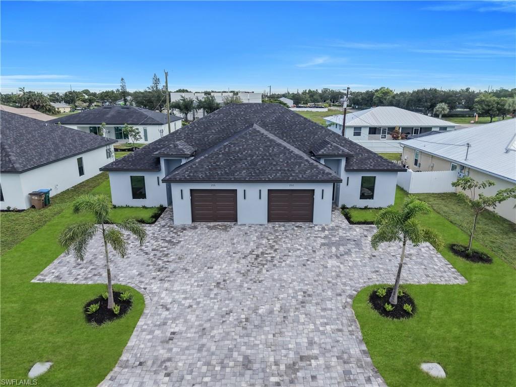 CITY WATER AND SEWER WITH ALL ASSESSMENTS PAID IN FULL, IMPACT-RESISTANT WINDOWS AND DOORS, NO HOA restrictions and NO FLOOD ZONE. Whether you're looking for a primary residence or an exceptional investment opportunity, this duplex is move-in ready and built to last. Brand-new CBS construction duplex offering the perfect blend of modern design, quality craftsmanship, and an unbeatable central Cape Coral location. Each never-occupied unit features 3 bedrooms, 2 bathrooms, beautiful porcelain tile flooring throughout, an interior laundry room, and energy-efficient tankless water heaters. Ideally situated within walking distance to Sun Splash Family Waterpark, The Courts pickleball and tennis complex, Cape Coral Charter School, a veterinary hospital, Santa Barbara Lanes, Eagle Skate Park, William "Bill" Austen Youth Center, CrossFit ENG, and Lake Kennedy Community Park, residents will enjoy easy access to some of Cape Coral's most popular recreational and community amenities. Combining premium construction, modern finishes, and a highly desirable location, this brand-new duplex offers an outstanding opportunity to own a quality property in one of Southwest Florida's fastest-growing communities.