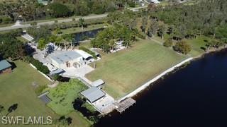 Just reduced to $769,500K. So here's your change if you area looking for a one-of-a-kind, unique property for multiple generations to gather or a place for your friends to come for the weekend? This private retreat could be yours today. Enjoy making life long memories for every age group- whether they enjoy gigging frogs into the wee hours of the night, bowling, bingo or blackjack down the road at the new Brighton Bay Casino, duck hunting out of Moonshine Bay, running the hill with their airboats or exploring the many nature trails Glades County has to offer.  There’s also hunting opportunities on one of the many nearby Lykes Brothers leases or taking a short drive into Okeechobee City for skeet shooting and Motor cross. Of course, there’s also the world renowned fishing on Lake Okeechobee that this property has direct access to through Lock S127. Take a look at all this property has to offer.  It’s a freshwater fishing enthusiasts dream property- a boat launch directly into the main rim canal, 22 ft electric boat lift, air boat ramp/storage, ample dockage as well as an air conditioned boat dock/ house. Just think of the fish stories that can be told while your cooking up your days catch or having an evening cocktail enjoying the incredible sunset views. There’s ample room for storage of all your hobbies, tackle and boats in the 36ftX50ft Metal Building as well as a bunk apartment with a full kitchen and bath. This would be a great space for the grandkids and their friends to tell ghost stories and make lasting memories while you enjoy a good nights sleep in the main home with its incredible water views. You and your family/friends won’t be sorry you took the time to make generational memories at this incredible property. An added bonus, Seller will entertain offers with 50% seller financing with approved credit.