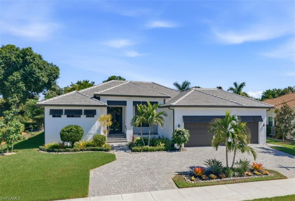 Experience the best of Marco Island living at 423 S. Barfield Drive, where exceptional privacy, thoughtful upgrades and inviting indoor-outdoor spaces come together on an oversized homesite. This beautifully appointed three-bedroom-plus-den, two-bath residence offers a spacious, comfortable floor plan enhanced by custom closets throughout, impact-resistant windows and doors, a $12,000 upgrade for electric blinds on all windows and doors, a whole-house water filtration system and a fully paid solar system for energy efficiency. The insulated, air-conditioned three-car garage provides exceptional versatility and storage. Designed for effortless entertaining and relaxation, the expansive outdoor living area features a sparkling saltwater pool, oversized spa with AquaLink controls plus a beautifully equipped outdoor kitchen with grill and Big Green Egg. Lush tropical landscaping and mature fruit trees, including avocado, papaya, fig and mango, create a private backyard oasis. Enhancing the peaceful setting, the property directly behind the residence is owned by the Audubon Society and dedicated to gopher tortoise habitat, providing a unique natural backdrop. Additional highlights include a circular driveway and an approximately 11-foot elevation. Ideally situated near Marco Island’s pristine beaches, boutique shopping, acclaimed restaurants and endless recreational opportunities, this exceptional residence offers a wonderful combination of privacy, sustainability and the relaxed elegance of island living.