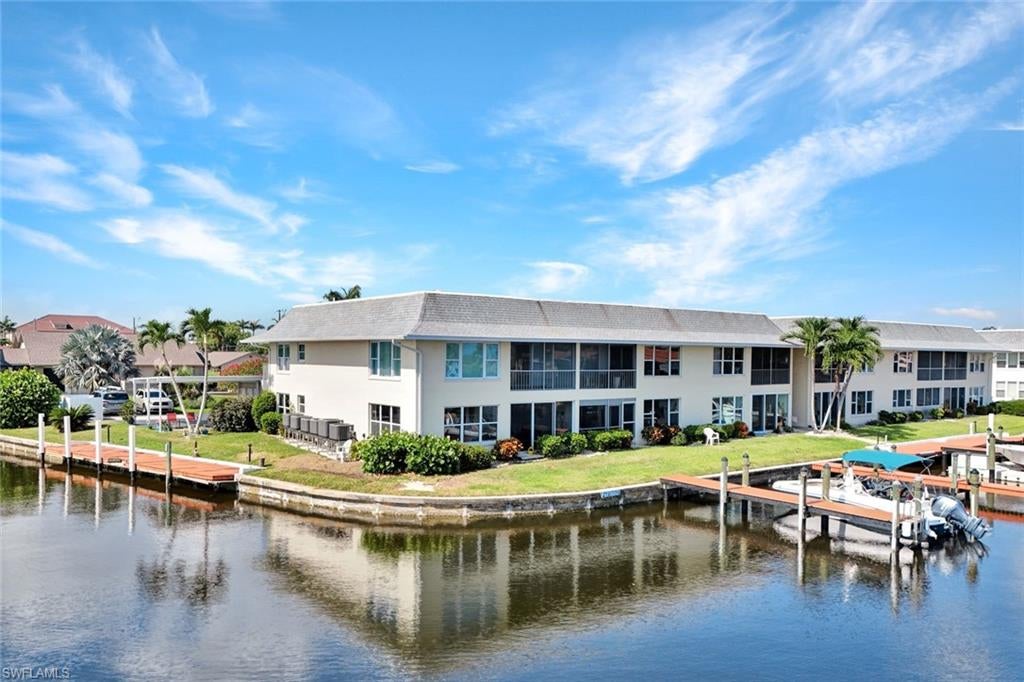 Wow what a view! Take in panoramic views of intersecting canals from this bright and spacious 2-bedroom, 2-bath end-unit in the well-maintained Coral Del Rio community. Located on the ground floor, this private corner condo offers quick, unrestricted access to the Gulf—a rare find for boating enthusiasts.

Interior updates include fresh paint, a new 2024 roof, and tasteful kitchen improvements. The primary bedroom opens to the lanai and features a private bath and walk-in closet. 

Extras include covered parking with a storage closet, guest parking, and a heated pool with canal views. The dock area offers a fish cleaning station, kayak racks, and a lift for launching paddle boards or kayaks. Pets are welcome (1 under 20 lbs).

Just a short walk to Jaycee Park, with exciting upgrades underway—including dining, entertainment, and boat access. No age restrictions and no special assessments make this a fantastic option for seasonal use or full-time living.