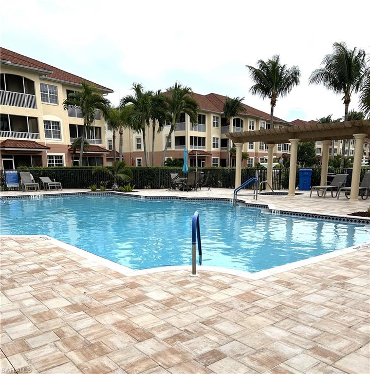 This fabulously well maintained gated community is located by all of the conveniences but, tucked away in a residential neighborhood away from all the traffic.  This unit is beautifully furnished and being sold turn key.  You can move right into this 2 bedroom, 2 bath, with media room/den, and screened balcony with tile flooring.  The kitchen features a breakfast room, breakfast bar, updated appliances, quartz countertops with tiled backsplash, a pantry plus roped and canned ceiling lighting.  Light fixtures have been updated as well as ceiling fans and flooring.  The clubhouse features a resort-style pool and jacuzzi, a full kitchen, banquet area, billiard table, and exercise room.  Many activities are available for you to participate in, if you choose.  There are sidewalks throughout the courtyard leading to the clubhouse with beautiful water fountains.  The building has an elevator and trash shute for your convenience, as well as an outside storage unit.  This condo has everything you need.