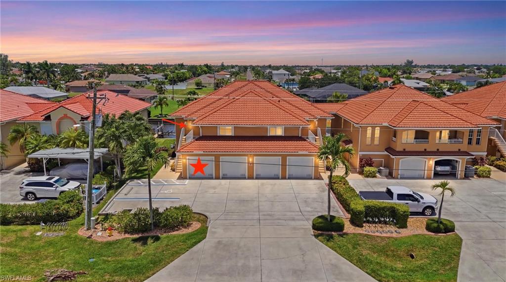 Welcome to 917 SW 47th Terrace, Unit 201, Cape Coral, FL 33914—a beautiful end-unit condominium offering the perfect blend of comfort, style, and convenience in one of Southwest Cape Coral's most desirable locations.

Built in 2004, this spacious 3-bedroom, 2-bathroom home offers 1,336 square feet of thoughtfully designed living space, along with a one-car garage. As an end unit, you'll enjoy additional privacy, abundant natural light, and an open, inviting atmosphere throughout.

The kitchen has been tastefully updated with quartz countertops and beautifully refinished cabinetry, creating a modern space that's perfect for both everyday living and entertaining. Major improvements include a new A/C system installed in 2021 and a new water heater in 2023, giving buyers added peace of mind.

Designed to embrace the Florida lifestyle, the screened lanai features hurricane-rated sliding glass doors along the screened enclosure, allowing you to seamlessly incorporate the lanai into your living space while keeping the area cool and comfortable year-round. From here, you'll enjoy peaceful canal views and an ideal setting for relaxing or entertaining. Additional storm protection includes impact-resistant windows throughout and a roll-down hurricane shutter on the primary bedroom window, providing added security and peace of mind.

Located in the heart of Southwest Cape Coral, you'll be just minutes from the vibrant Cape Harbour Marina, Tarpon Point Marina, waterfront dining, boutique shopping, parks, and entertainment. Enjoy easy access to Cape Coral Parkway, making trips to downtown Cape Coral, Fort Myers, area beaches, and nearby golf courses quick and convenient. Whether you're looking for a year-round residence, seasonal retreat, or investment opportunity, this exceptional condo places you close to everything Southwest Florida has to offer.

Don't miss your opportunity to own this move-in-ready home in one of Cape Coral's most sought-after locations.