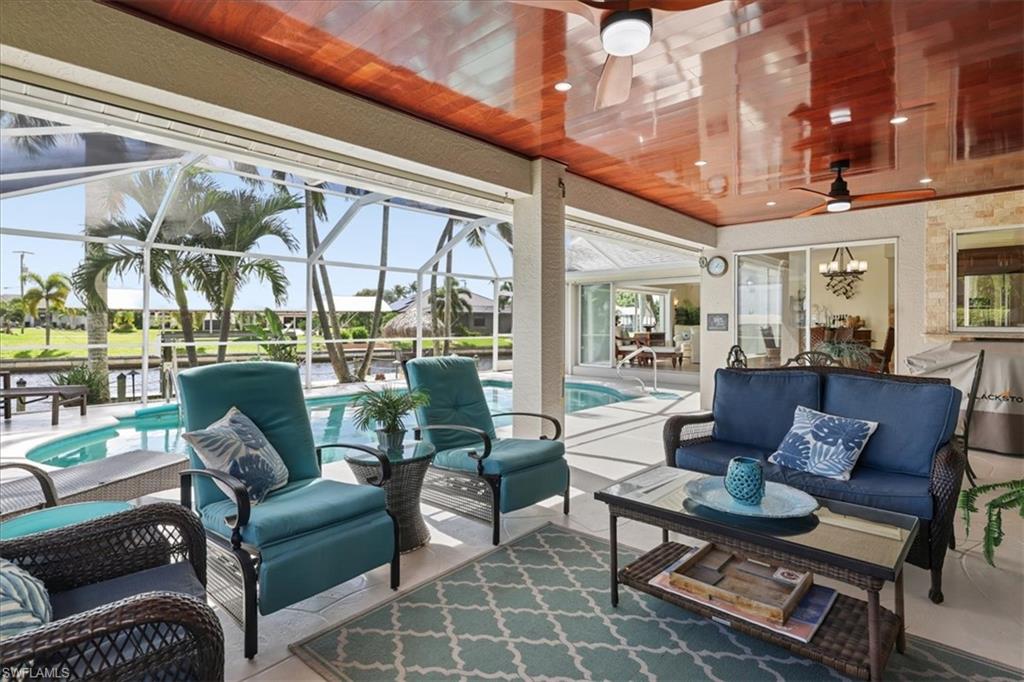 COMPLETELY TURNKEY GULF ACCESS POOL HOME IN SOUTHWEST CAPE CORAL, FL 33914! 
Discover waterfront living at 1824 SW 45th Street, a meticulously maintained 3 bedroom, 2 bath, 2 car garage home situated on an intersecting canal with expansive water views, a private dock, 10,000 pound boat lift, and heated swimming pool. Beautifully furnished in a timeless British Colonial inspired style, blending classic elegance with relaxed tropical sophistication, this exceptional residence is being sold COMPLETELY TURNKEY, including furnishings, décor, and household essentials (subject to seller exclusions). Just bring your suitcase and start enjoying the Southwest Florida lifestyle!
Step inside to discover a beautifully appointed interior featuring travertine flooring, new wood look luxury vinyl plank flooring in the living room, crown molding, chair rail detailing, and an impressive picture window showcasing the spectacular waterfront views. The custom kitchen features beautiful cabinetry and granite countertops. Every detail reflects the care and attention this home has received over the years.
Step outside to your private waterfront retreat! Relax beside the heated pool, entertain on the spacious screened patio featuring a beautiful mahogany ceiling, or enjoy your morning coffee at the dockside tiki table while overlooking the picturesque intersecting canals. The recently replaced dock features a 10,000 pound boat lift with a brand new cover, making this Cape Coral Gulf access property an ideal setting for boating enthusiasts and waterfront entertaining.
Meticulously maintained and thoughtfully updated, this home reflects exceptional pride of ownership! Recent improvements include new luxury vinyl plank flooring in the living room (2026), kitchen sink (2026), stove (2026), washer and dryer (2025), pool heat pump (2025), pool pump (2024), and pool cage rescreening (2023). Additional features include beautifully renovated bathrooms (2016), a 2018 shingle roof, hurricane protection with Storm Smart screens and clear storm panels, and a garage door opener with camera and battery backup (2026). City water and sewer assessments are FULLY PAID! Per seller, the home did not experience flooding during Hurricane Ian. The existing flood insurance policy is ASSUMABLE, with a current annual premium of approximately $1,974, subject to applicable transfer requirements and premium verification.
Located in desirable Southwest Cape Coral, this Gulf access waterfront home combines exceptional condition, timeless coastal elegance, and the convenience of a truly move in ready property. Whether you're searching for a primary residence, seasonal retreat, or waterfront getaway, this property offers the opportunity to enjoy Southwest Florida boating, beautiful canal views, and poolside relaxation without the hassle of furnishing a home. YOUR FLORIDA WATERFRONT LIFESTYLE STARTS HERE!