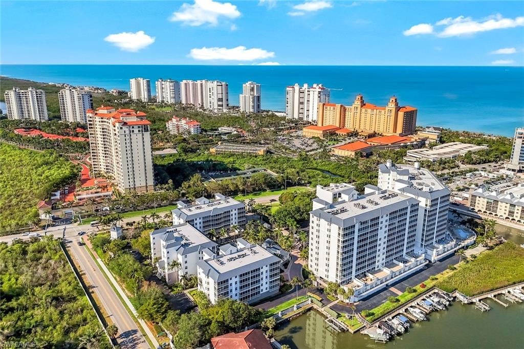 Coastal Charm by the Gulf – This bright 9th-floor end-unit condo brings nearly 2,000 sq. ft. of relaxed, open living with stunning Gulf and Bay views. With three bedrooms and two-and-a-half baths, the airy layout includes a cozy sitting area off the kitchen and a spacious lanai—perfect for kicking back after a day at the beach and soaking in those spectacular sunsets.

Freshly painted and filled with natural light from extra side windows, this home feels bright and inviting. The kitchen has been updated with new cabinetry, featuring cheerful blue lower cabinets, a decorative tile backsplash, and all newer appliances. New wood-look flooring flows throughout, giving a warm, modern coastal vibe. Bathrooms have been tastefully refreshed for comfort and style.

Whether you’re looking for a vacation escape or a rental-ready investment, this condo offers flexibility, charm, and ease. It also includes one assigned parking space and a private, secure storage room.

Regatta is one of the few pet-friendly communities along Vanderbilt Beach, welcoming your four-legged friends. Part-time owners enjoy a flexible rental policy and a proven track record of rental income. Amenities include a tropical waterfall pool, relaxation pool, fitness rooms, grilling areas, and boat docks.

Just 500 steps from the beach and steps from the Ritz Carlton, you’re close to shopping, dining, galleries, and entertainment at Mercato, Pavilion, and Waterside Shops. Tennis and pickleball courts are planned nearby, adding even more outdoor fun.

Secure, well-maintained, and right on the water, Regatta is the perfect place for beach lovers, boaters, and anyone ready to embrace the coastal lifestyle. Relax, unwind, and live the good life!